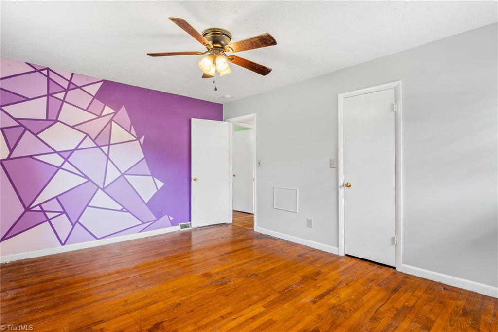 753 Wolf Island Road Reidsville, NC 27320 - Photo 26 of 42 Second bedroom has painted accent wall
