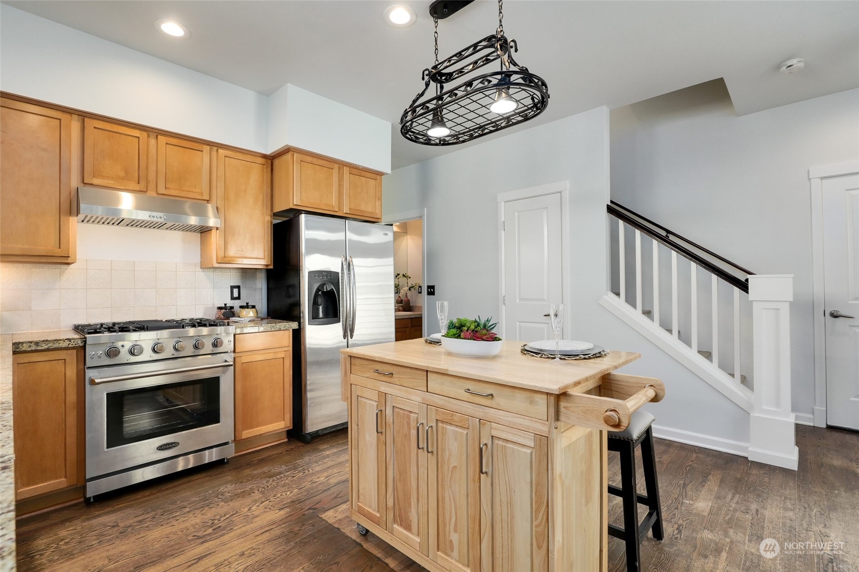 23920 34th Avenue Southeast, Unit 27 Bothell, WA 98021 - Photo 8 of 15 a kitchen with stainless steel appliances a white cabinets and stove top oven
