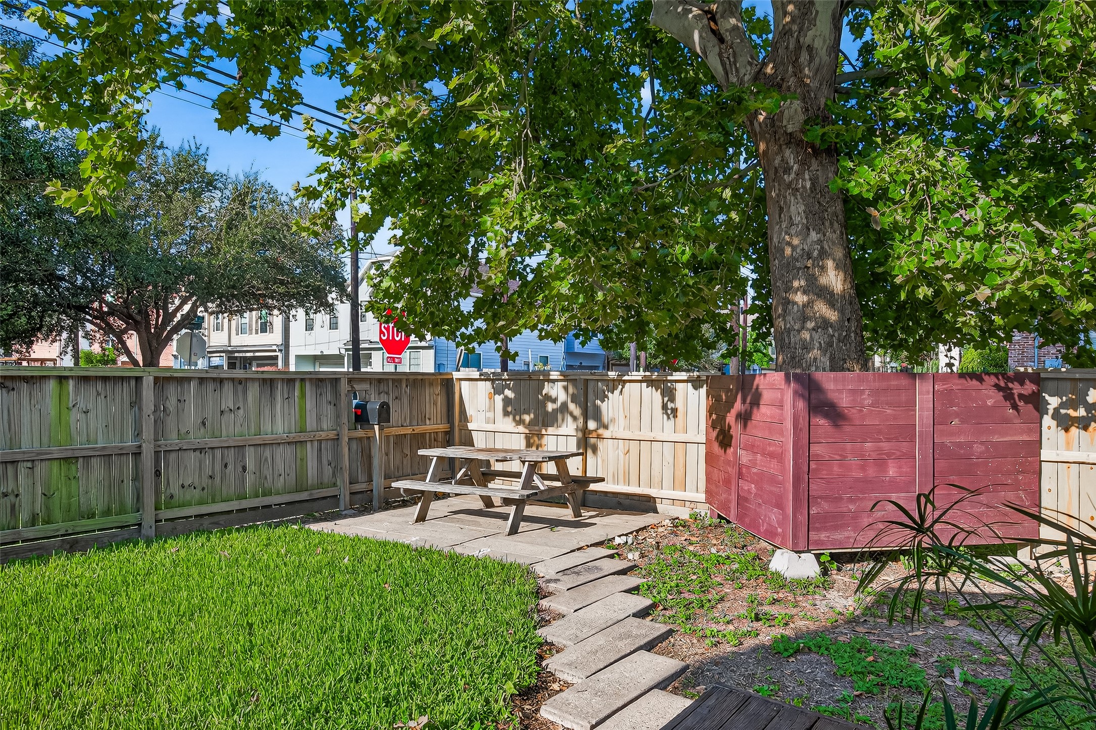 5122 Larkin Street Houston, TX 77007 - Photo 25 of 28 Check out this sweet back yard! Privacy fence, picnic table under a tree, and lots of grass for you or your pets.