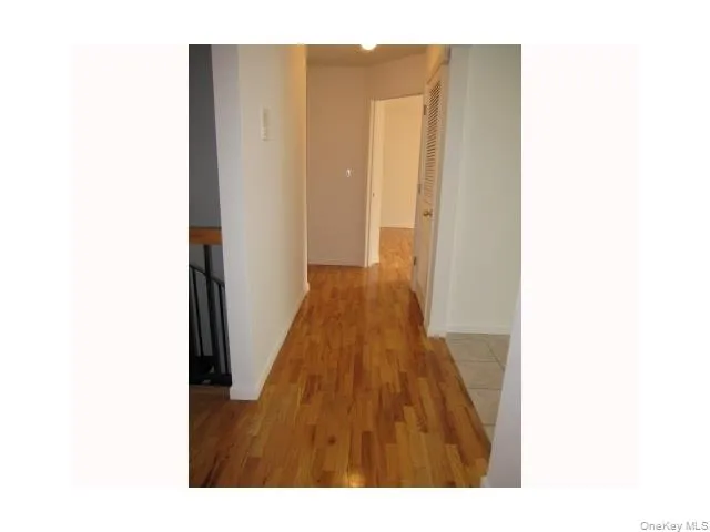 a hallway with wooden floor
