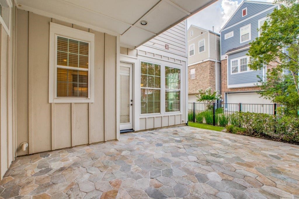 46 East Rafters Row The Woodlands, TX 77380 - Photo 22 of 25 Private covered courtyard creates the perfect outdoor retreat for relaxing or entertaining.