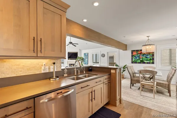 a kitchen with stainless steel appliances granite countertop a sink and cabinets