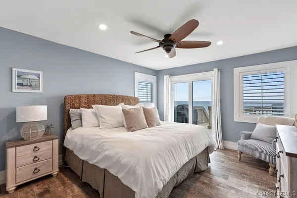 a spacious bedroom with a large bed and a window