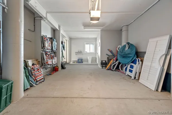 a bedroom with bed and a window