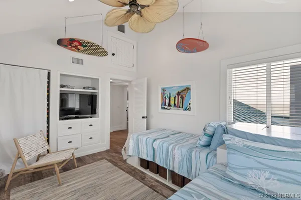a bathroom with double vanity sink a mirror and a bathtub