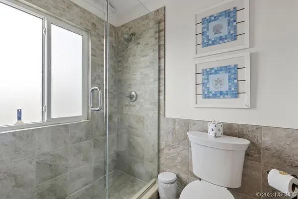 a view of a bedroom with wooden floor and stairs