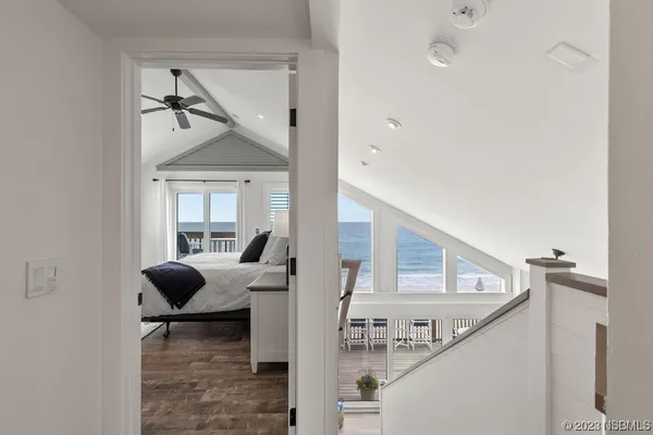 a bedroom with furniture and a flat screen tv