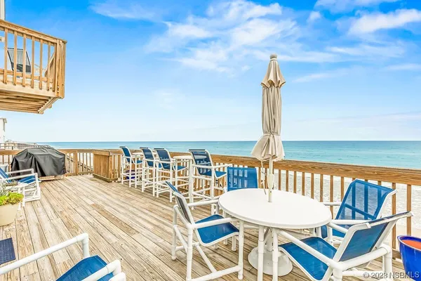 a view of balcony with furniture