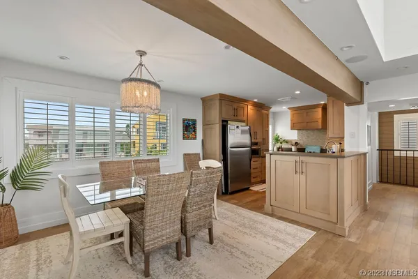 a view of a dining room with furniture window and outside view