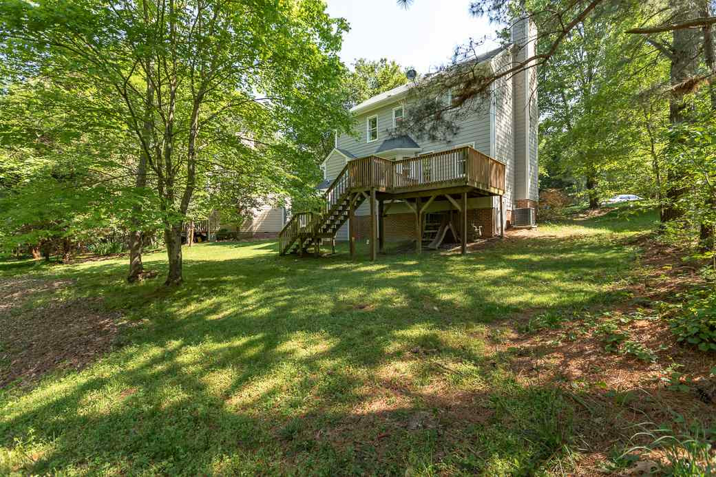 3 Hitching Rack Court Durham, NC 27713 - Photo 9 of 9 This large deck overlooking the mature trees. lush landscaping and amazing property, is the perfect place to set up your grill and start making wonderful memories in your new house! Exterior Back