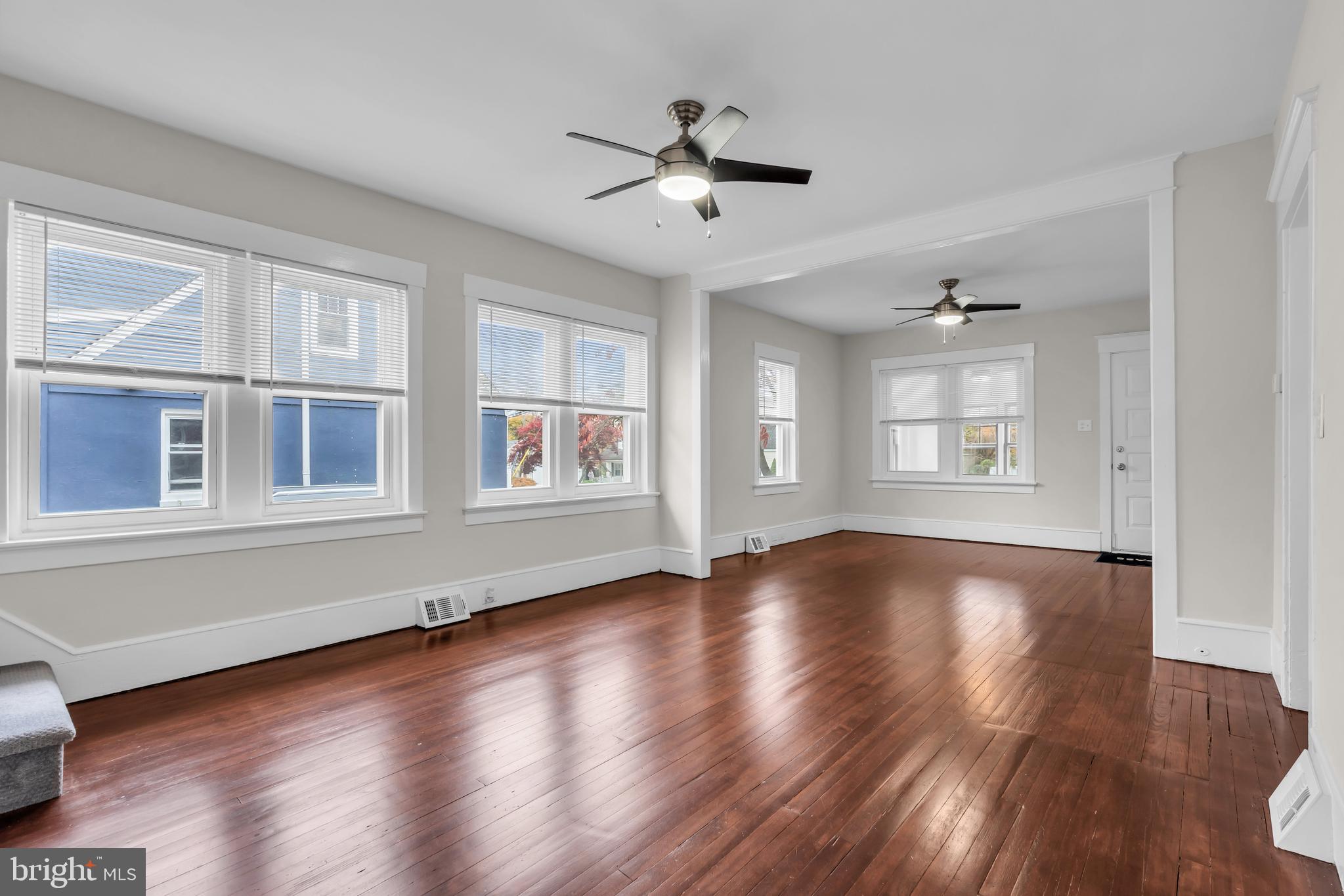 29 Saybrook Avenue Trenton, NJ 08619 - Photo 12 of 31 a view of an empty room with wooden floor and a window
