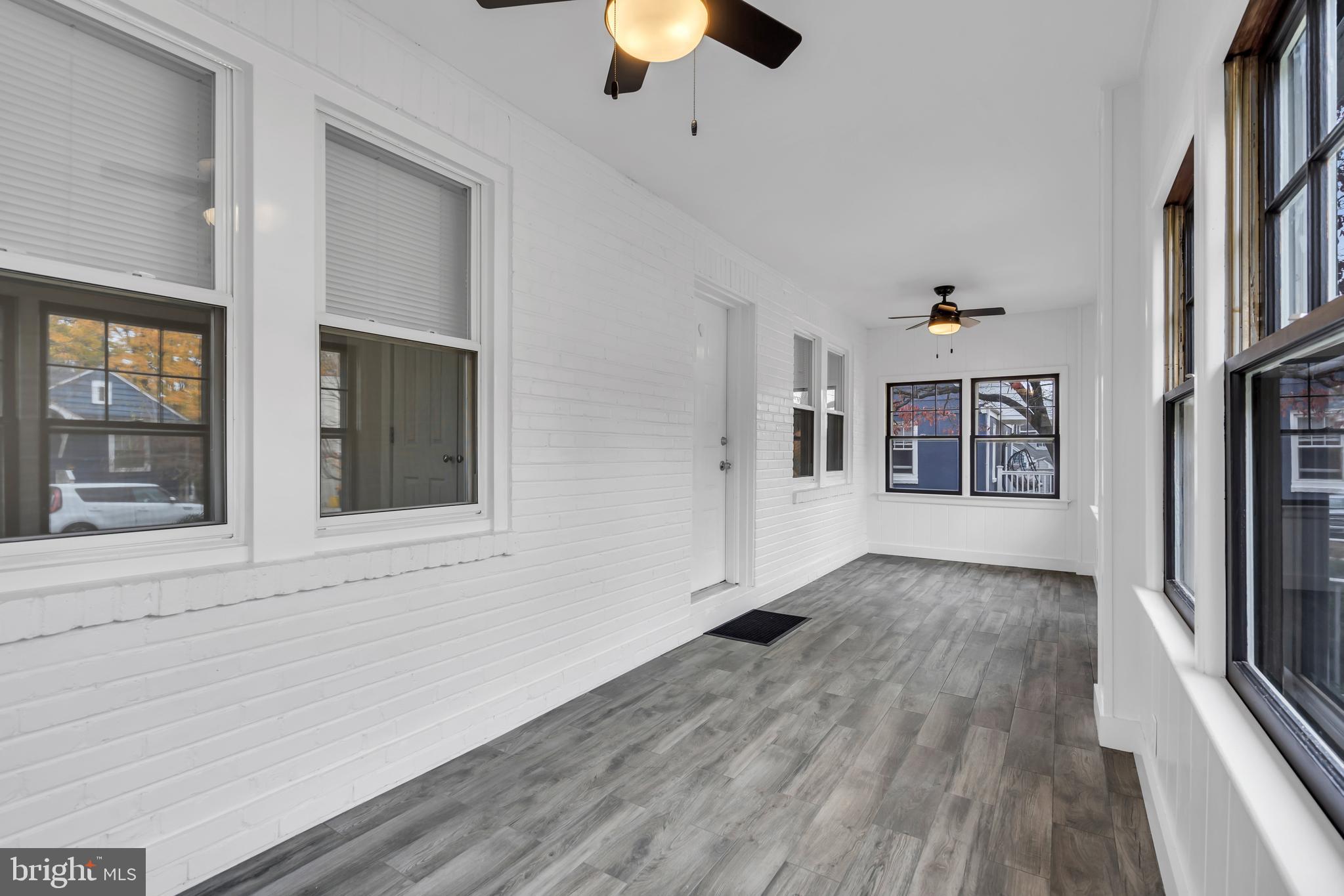 29 Saybrook Avenue Trenton, NJ 08619 - Photo 13 of 31 wooden floor in an empty room with a window