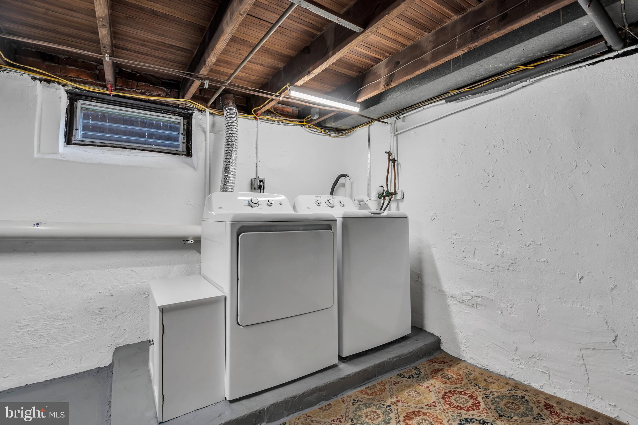 29 Saybrook Avenue Trenton, NJ 08619 - Photo 25 of 31 a utility room with a sink and wooden cabinets