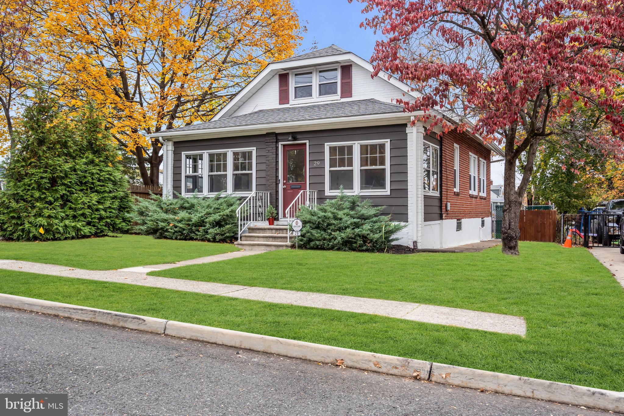 29 Saybrook Avenue Trenton, NJ 08619 - Photo 3 of 31 a front view of a house with a yard