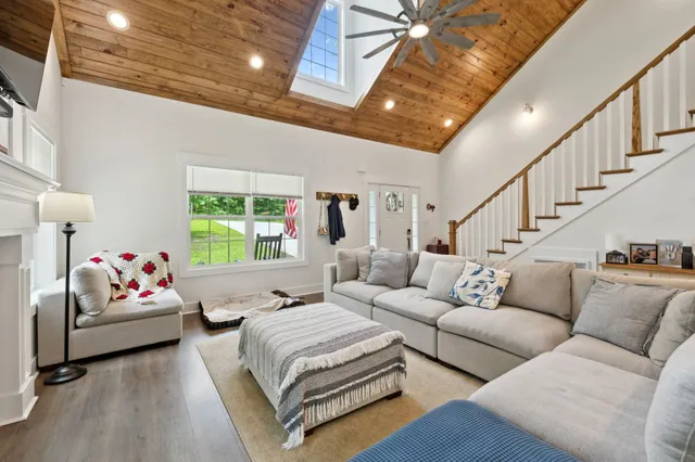 a bedroom with furniture and a window