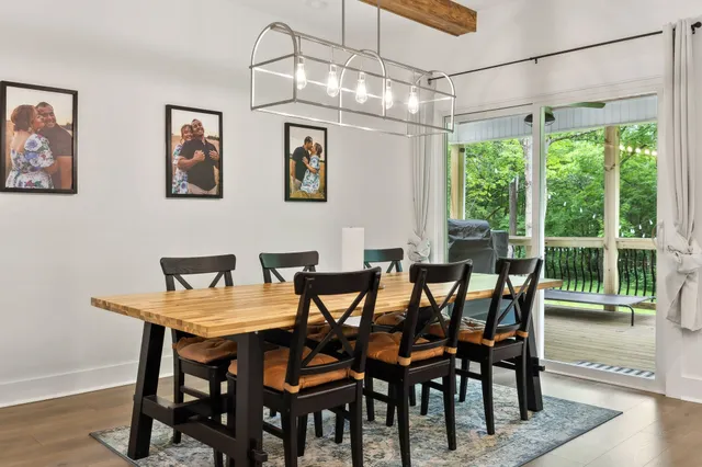 a kitchen with granite countertop a refrigerator stove top oven and sink