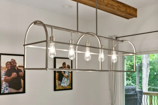 a spacious bathroom with a double vanity sink a mirror and a shower