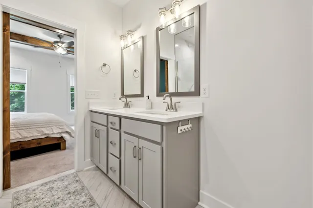 a bathroom with a shower and a sink