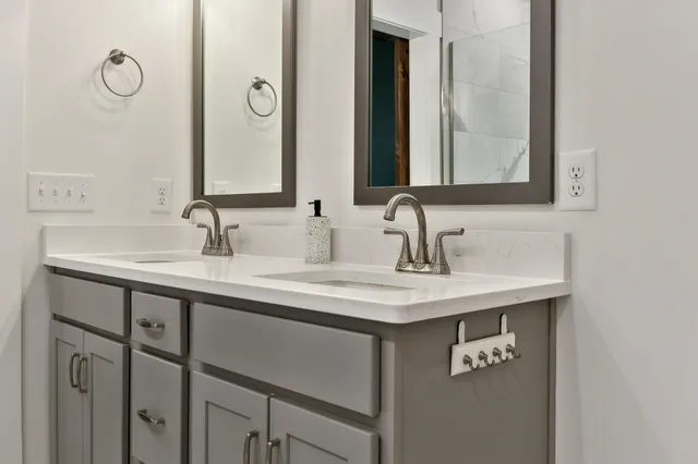 a view of a bedroom with furniture and window
