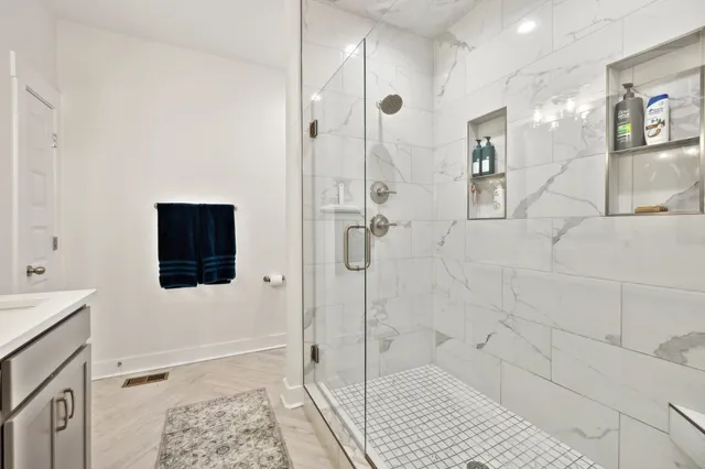 a bedroom with a bed and ceiling fan