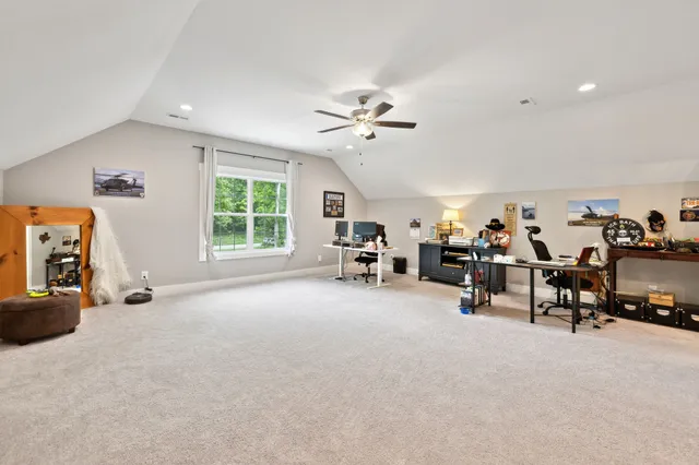 a view of a balcony with furniture and wooden floor