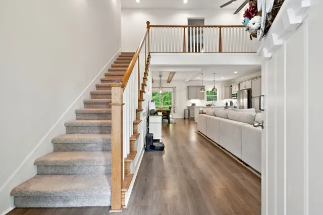 a living room with furniture fireplace and a flat screen tv