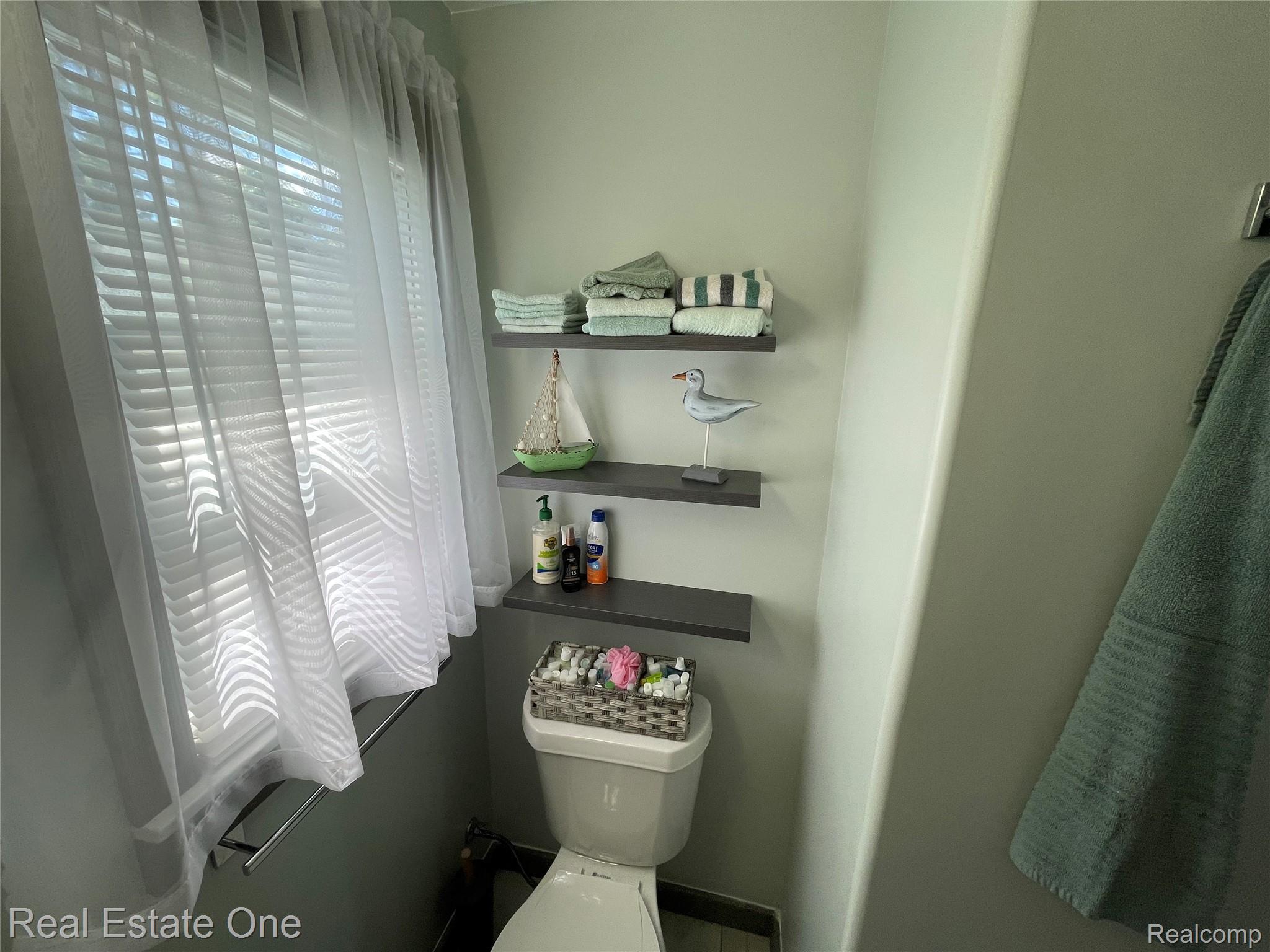 4160 Hawk Road Lincoln, MI 48742 - Photo 33 of 48 Wall-mounted floating shelves provide vertical storage