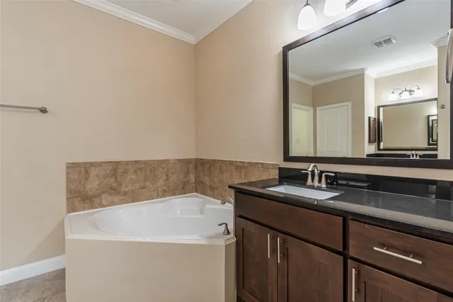 a bathroom with a shower and a sink