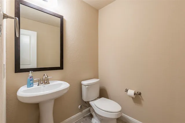 an empty room with closet and a chandelier fan