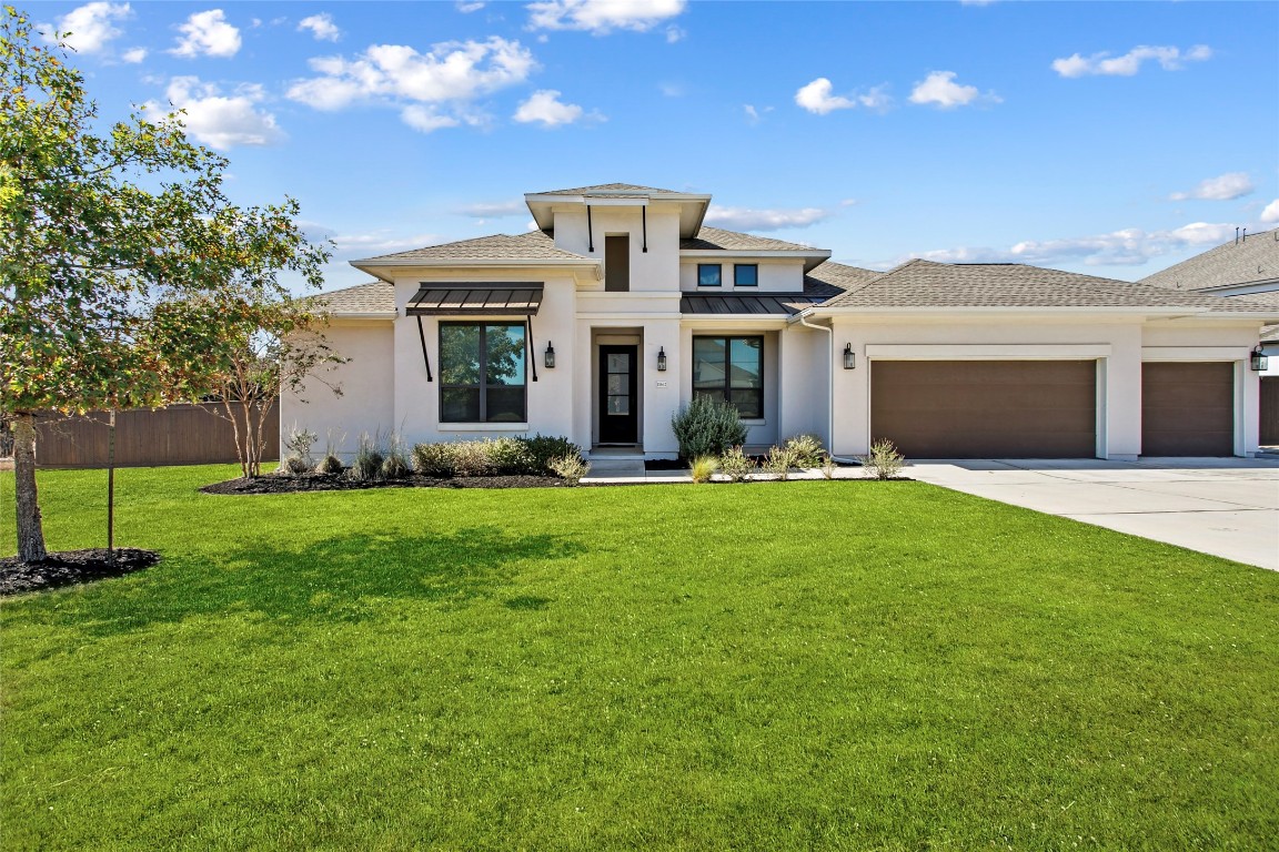 11632 Mesa Verde Drive Austin, TX 78737 - Photo 1 of 1 a front view of a house with garden