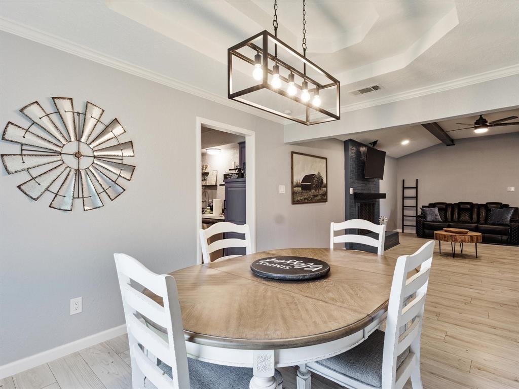 108 Sunview Street Sunnyvale, TX 75182 - Photo 13 of 29 a view of a dining room with furniture and wooden floor