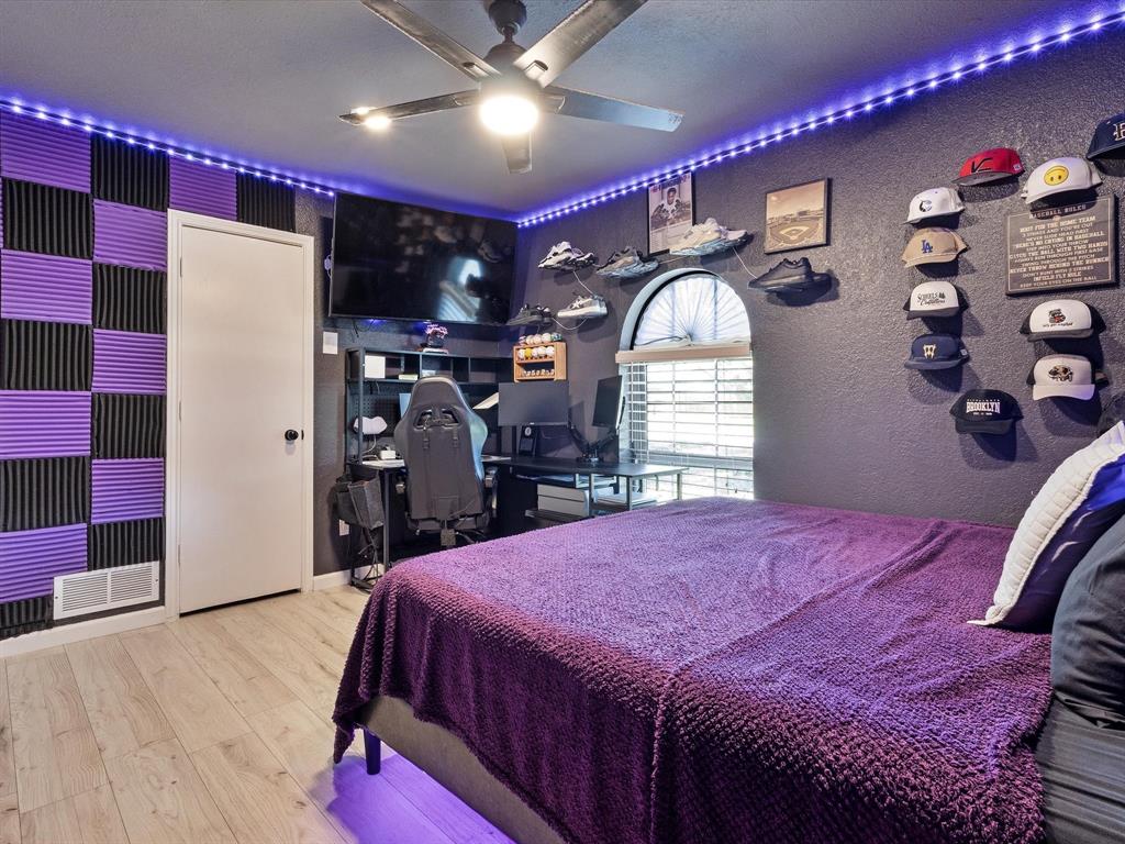 108 Sunview Street Sunnyvale, TX 75182 - Photo 18 of 29 a bed room with a bed and a mirror