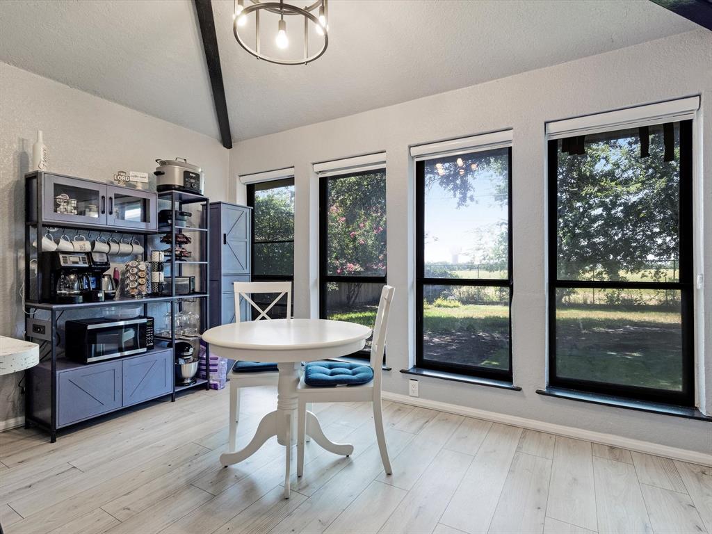 108 Sunview Street Sunnyvale, TX 75182 - Photo 24 of 29 a living room with furniture large window and wooden floor