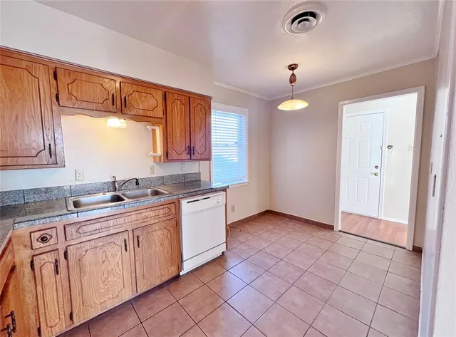 a kitchen with a sink and cabinets