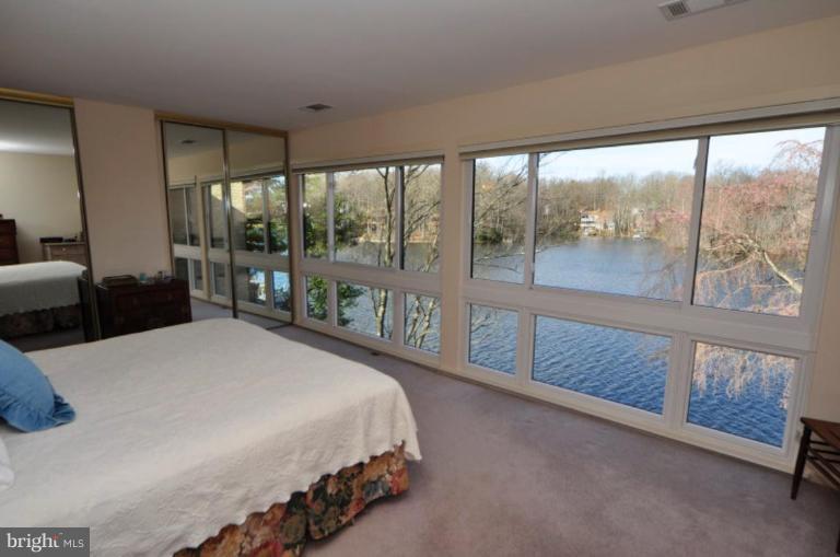 2004 Lakebreeze Way Reston, VA 20191 - Photo 5 of 30 A WALL OF WINDOWS OFFERS LAKE VIEWS IN THE MBR.