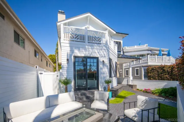 a front view of a house with swimming pool and porch