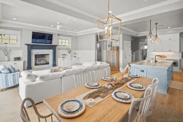 a dining room with furniture and a fireplace