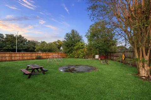 a backyard of a house with lots of green space