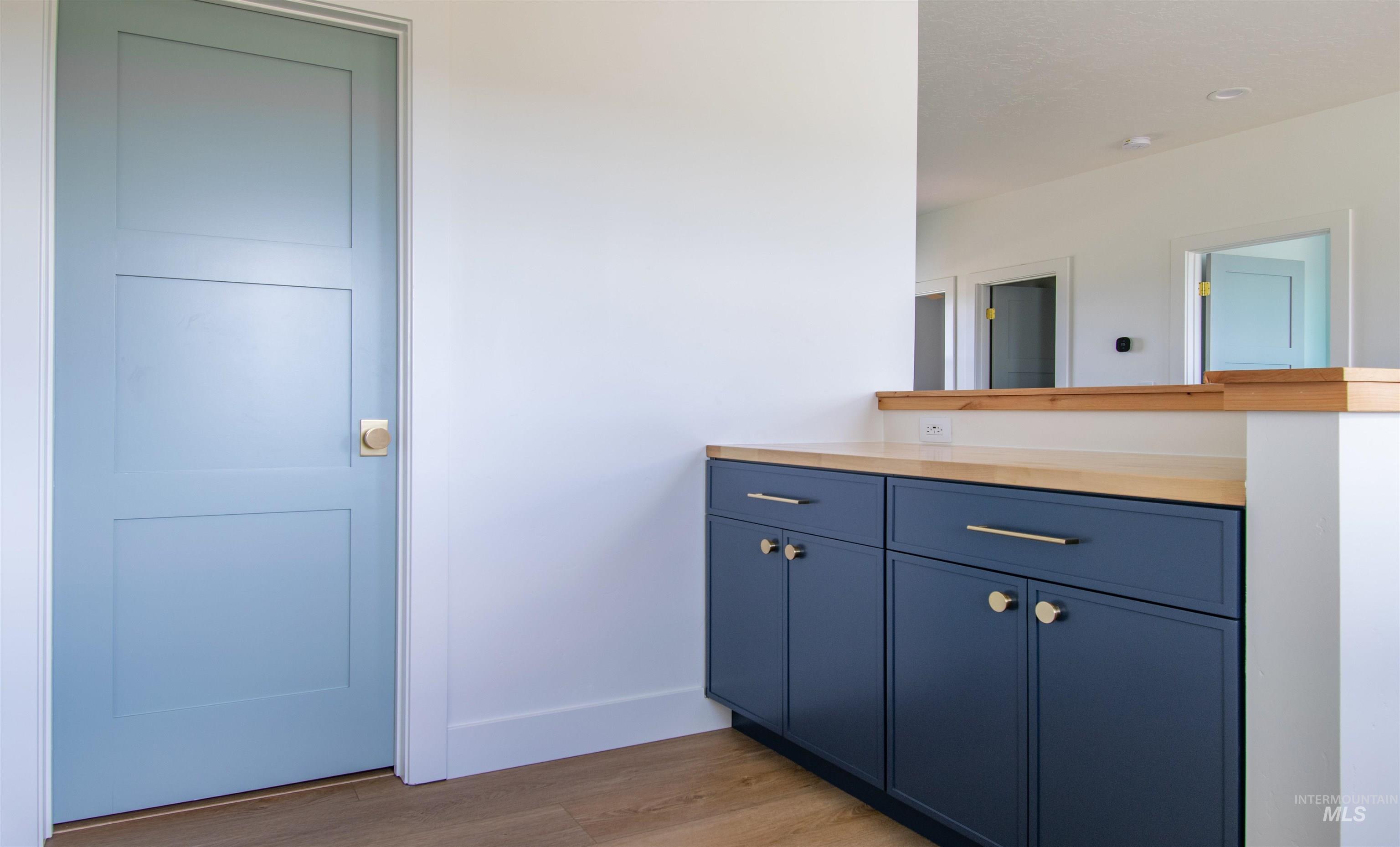 44 Big Moose Road McCall, ID 83638 - Photo 27 of 50 Blue three-panel interior door with a brass knob