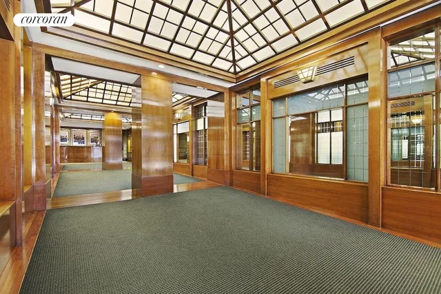 a view of empty room with large windows