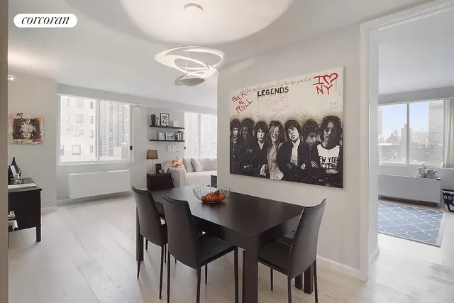 a view of a dining room with furniture and window