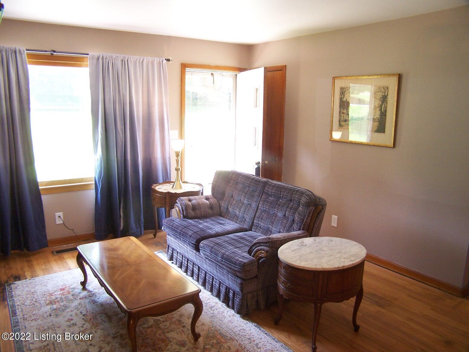 1627 Whippoorwill Road Louisville, KY 40213 - Photo 11 of 29 Living Room with hardwood flooring, large picture window for natural lighting, access to the Dining Room and the Eat-In Kitchen.