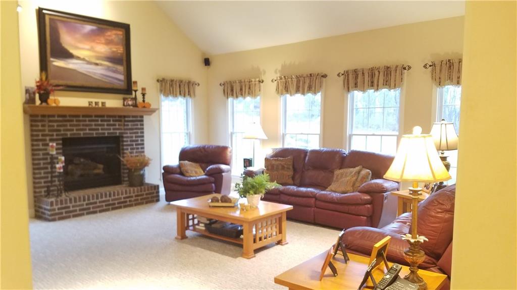1003 Timber Ridge Court Harrison City, PA 15636 - Photo 14 of 25 OVER-SIZED FAMILY ROOM HAS GAS FIREPLACE WITH VAULTED CEILING,WALL OF PELLA WINDOWS AND 2ND STAIRCASE TO 2ND FLOOR!
