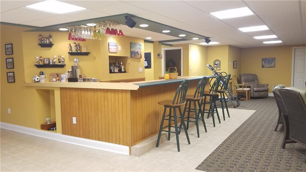 1003 Timber Ridge Court Harrison City, PA 15636 - Photo 22 of 25 FULL WET BAR WITH BAR STOOLS AND HEATED FLOOR SYSTEM!!