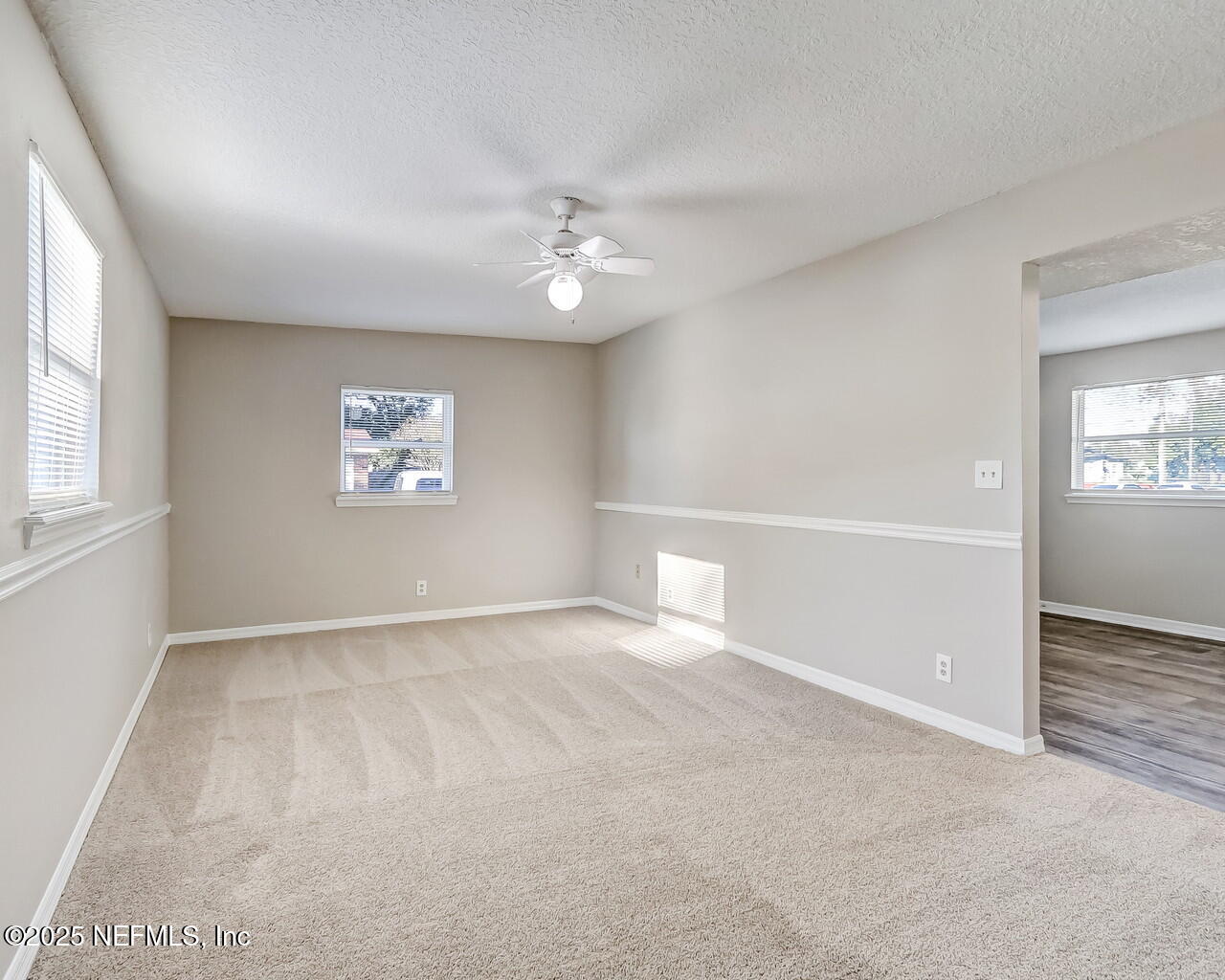 2028 Hartridge Street Jacksonville, FL 32209 - Photo 16 of 33 an empty room with windows and fan