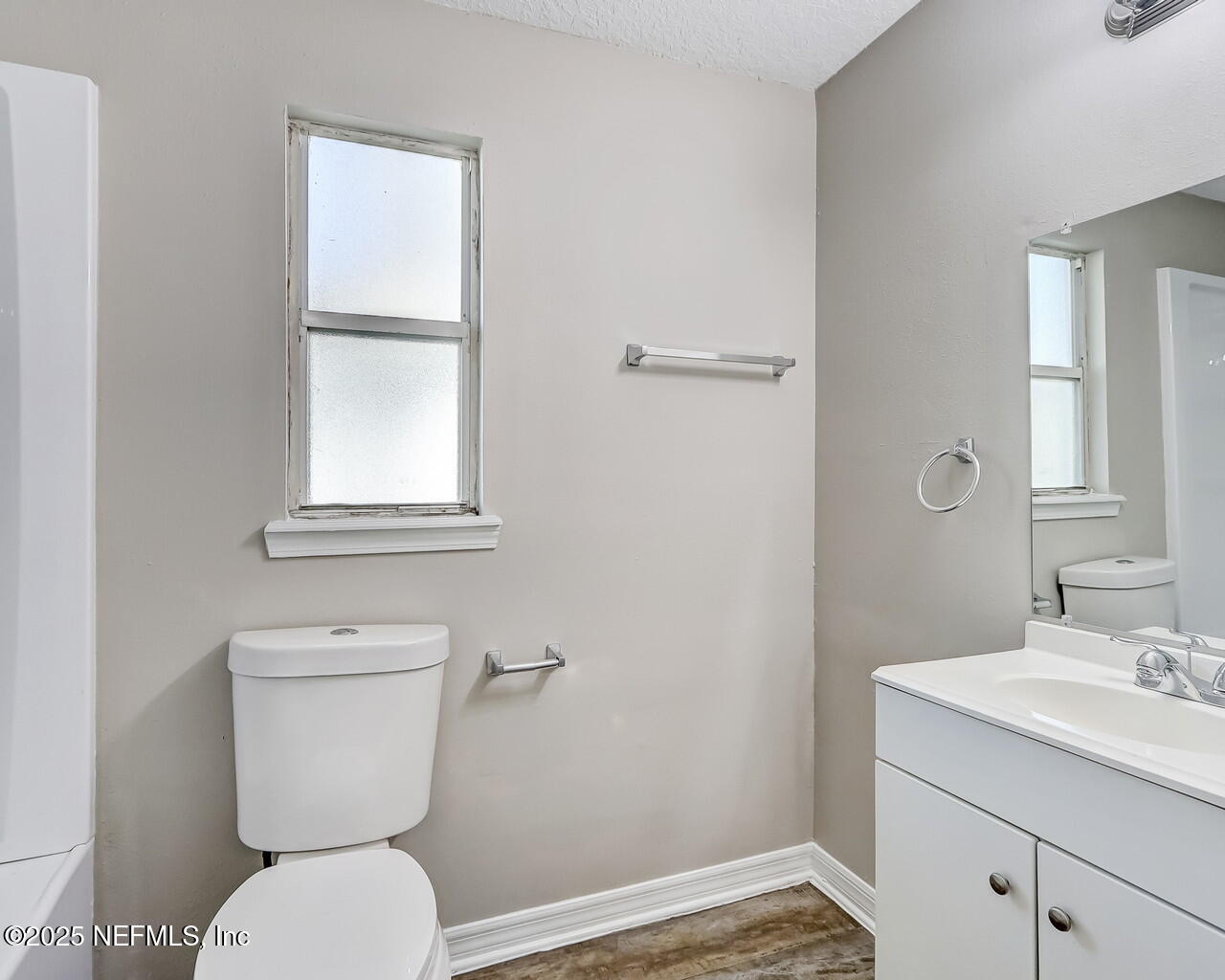 2028 Hartridge Street Jacksonville, FL 32209 - Photo 20 of 33 a bathroom with a toilet sink and mirror