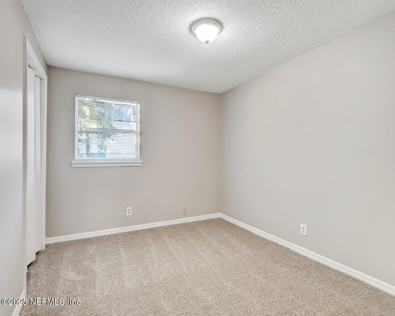 2028 Hartridge Street Jacksonville, FL 32209 - Photo 22 of 33 an empty room with a window