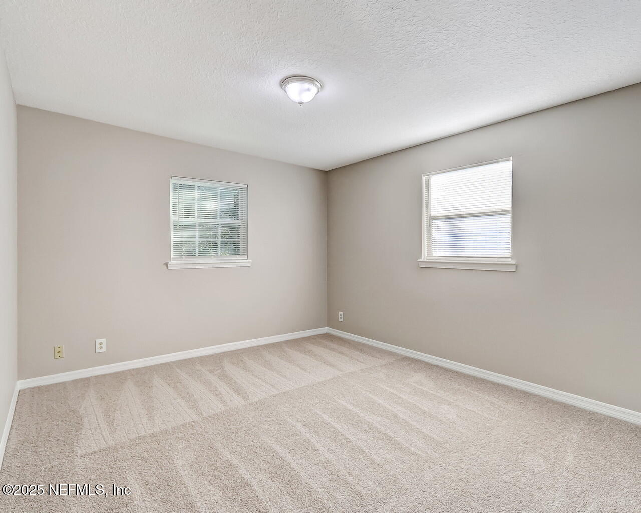2028 Hartridge Street Jacksonville, FL 32209 - Photo 24 of 33 an empty room with windows
