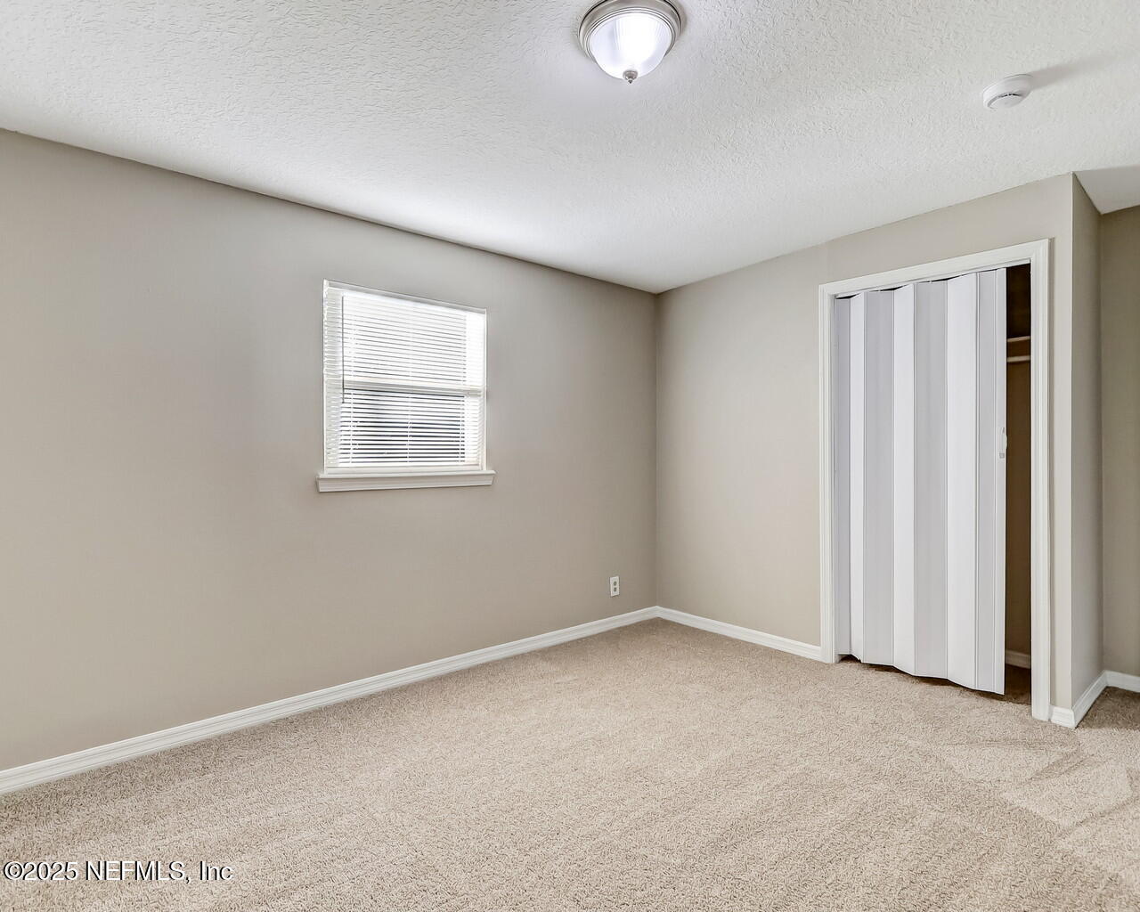 2028 Hartridge Street Jacksonville, FL 32209 - Photo 25 of 33 an empty room with windows