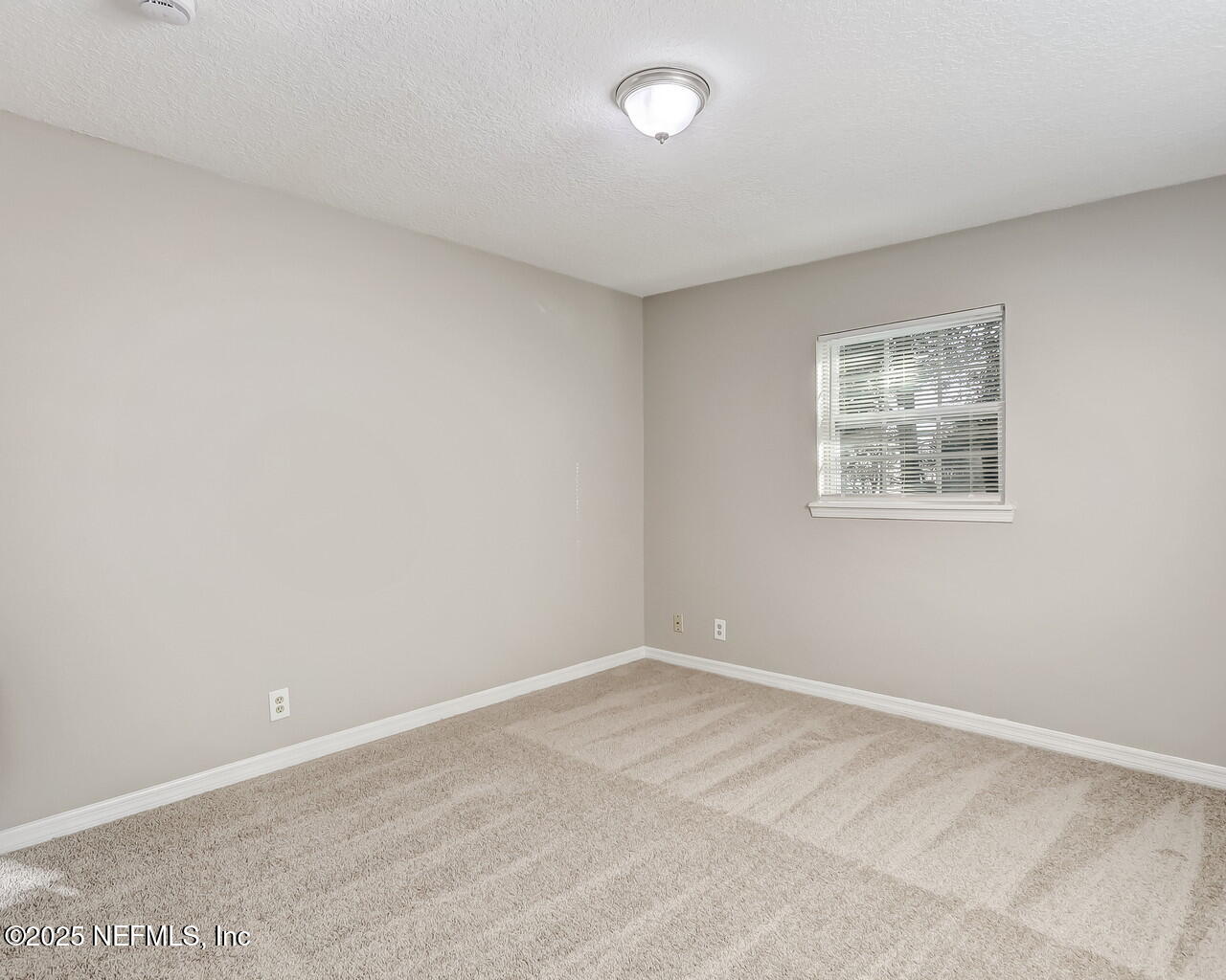 2028 Hartridge Street Jacksonville, FL 32209 - Photo 27 of 33 an empty room with a window